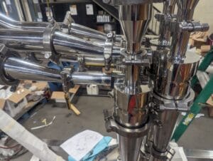 High polish piping for a pharmaceutical dust collection cyclone with high efficiency for product recovery