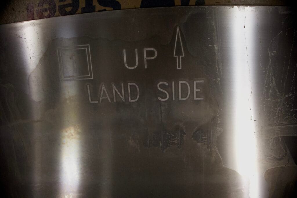 Aluminum panels etched with installation guides. These panels are a part of a modular floodgate system.