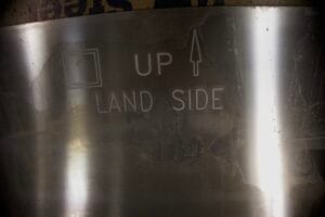 Aluminum panels etched with installation guides. These panels are a part of a modular floodgate system.