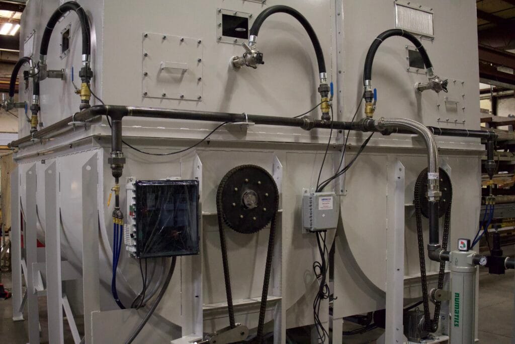 Final assembly of custom hopper and agitation system for fluff storage and handling.