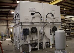 Final assembly of custom hopper and agitation system for fluff storage and handling.