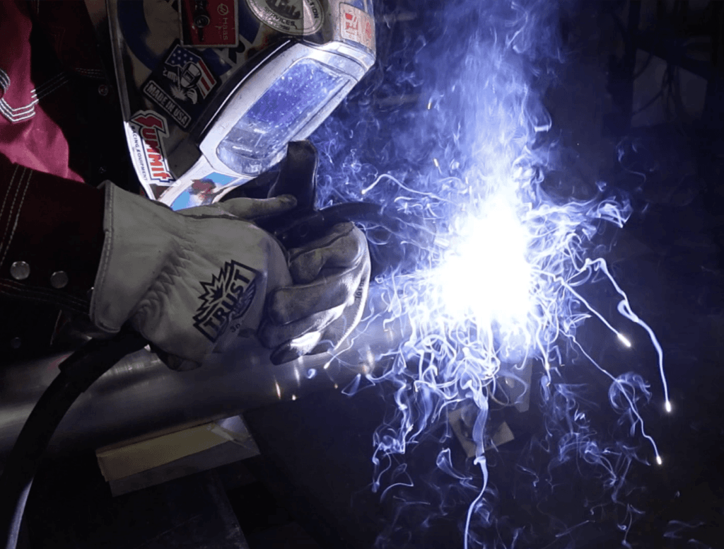 Certified welder performing ASME code welding on a steel pressure vessel at Heumann Environmental's fabrication shop in Jeffersonville, IN.