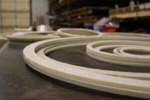 Fiberglass rings cut on the waterjet in the Heumann Environmental, Jeffersonville shop.